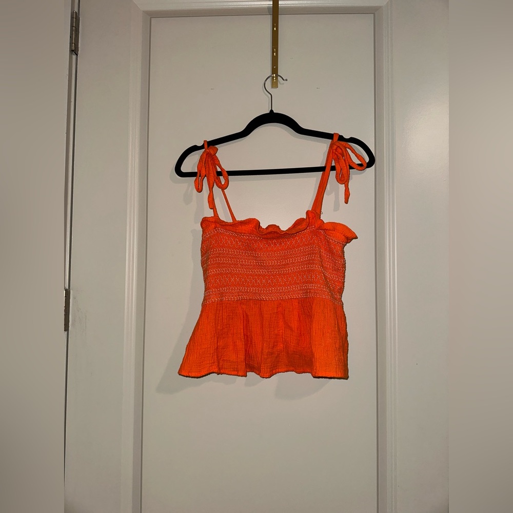 Free people orange peplum stretch stitch top with bows